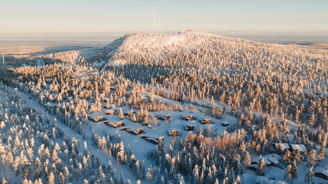 Airview of Rukalodge with Juhannuskallio cliff and Ruka slopes at the background. Photo Mikko Santasalo