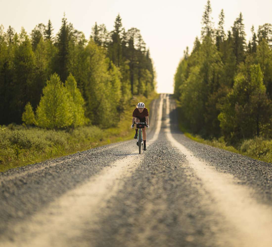 Enjoying downhill on a gravel road in Kuusamo. Photo Phil Gale & Emmie Collinge